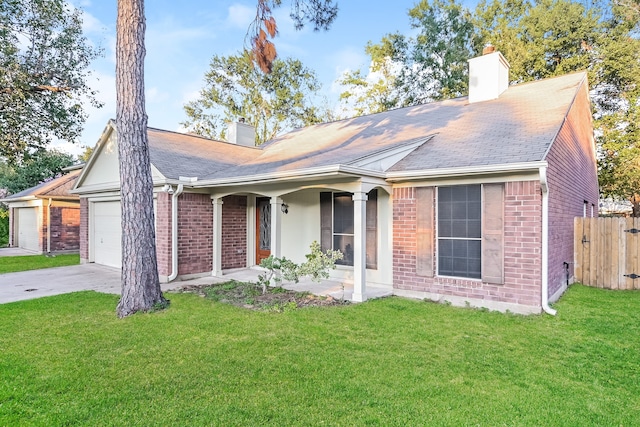 ranch-style house featuring a garage and a front yard