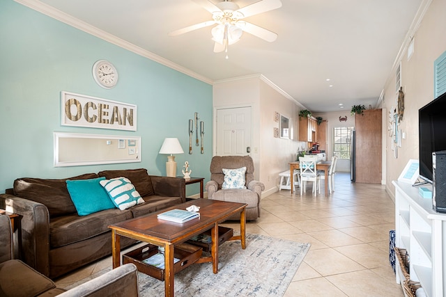 living room with ornamental molding, ceiling fan, and light tile patterned floors