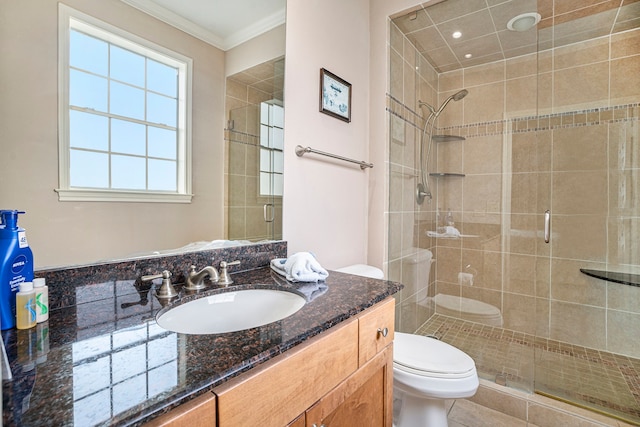 bathroom with vanity, walk in shower, ornamental molding, toilet, and tile patterned floors