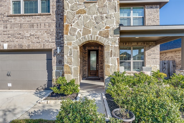 doorway to property featuring a garage