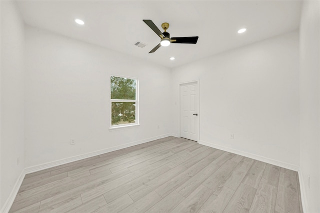 spare room with ceiling fan and light hardwood / wood-style flooring