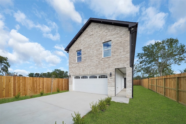 view of home's exterior featuring a lawn and a garage