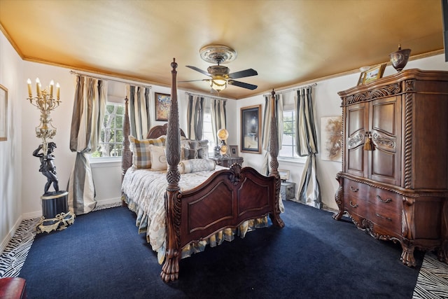 bedroom with multiple windows, carpet flooring, ornamental molding, and ceiling fan