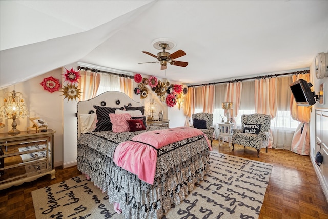 bedroom featuring parquet flooring, lofted ceiling, and ceiling fan