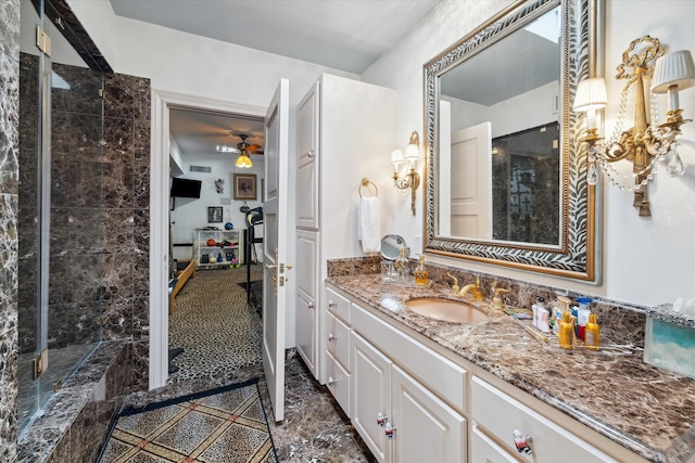 bathroom featuring vanity, ceiling fan, and an enclosed shower