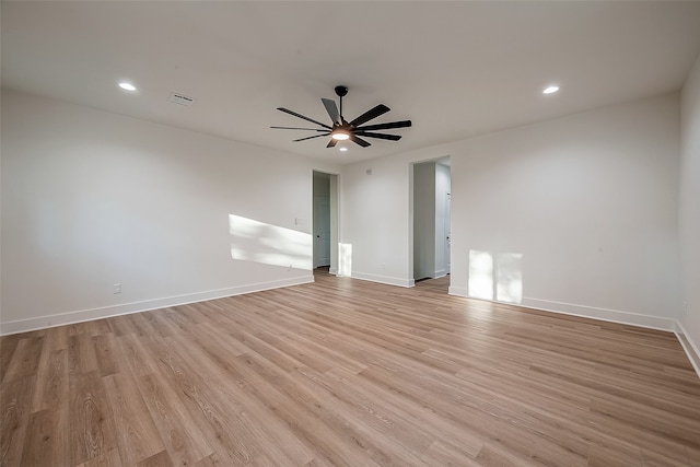 spare room with light hardwood / wood-style floors and ceiling fan