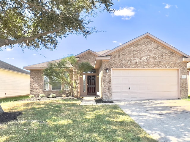 view of front of property featuring a front yard and a garage