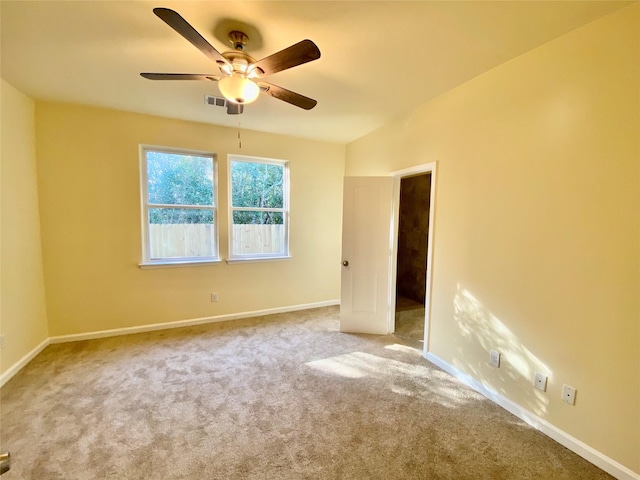 carpeted empty room with ceiling fan