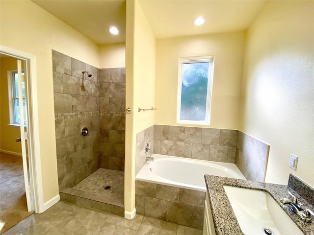 bathroom featuring vanity and plus walk in shower