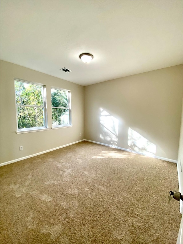 spare room with carpet flooring