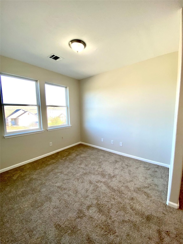 spare room with carpet floors