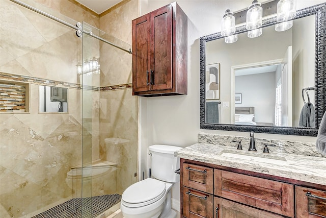 bathroom with vanity, toilet, and walk in shower