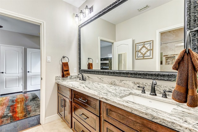 bathroom featuring vanity and tile patterned flooring