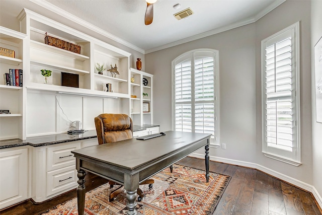 office space featuring ornamental molding, dark wood-type flooring, and ceiling fan