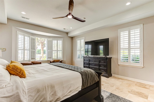 bedroom with multiple windows and ceiling fan