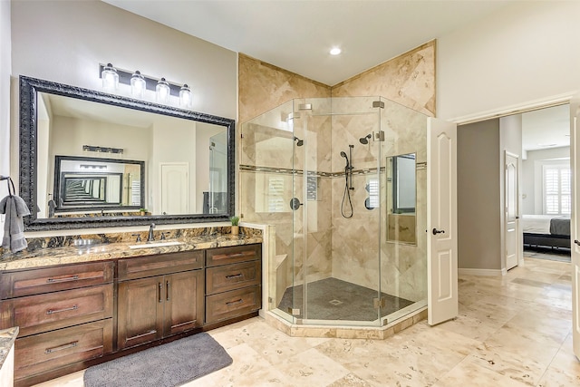 bathroom featuring vanity and a shower with shower door