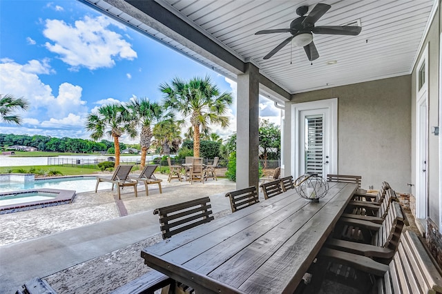 view of patio / terrace with a pool with hot tub and ceiling fan