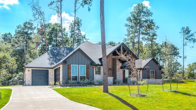 view of front of house with a garage and a front yard