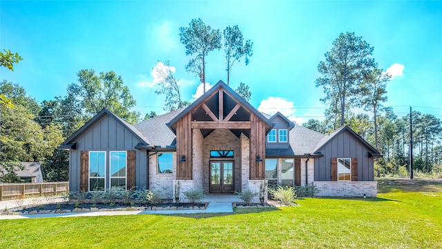 exterior space with french doors and a front lawn