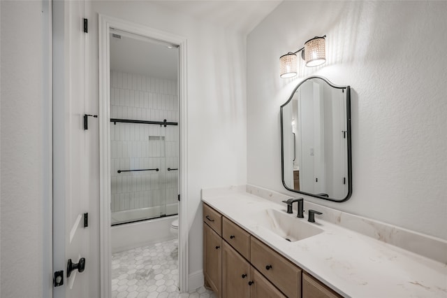 full bathroom featuring tile patterned flooring, vanity, toilet, and enclosed tub / shower combo