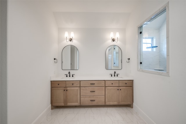 bathroom with vanity and lofted ceiling