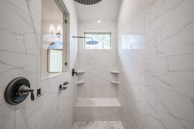 bathroom with a tile shower