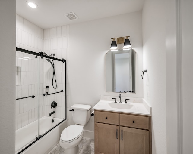 full bathroom with combined bath / shower with glass door, vanity, and toilet