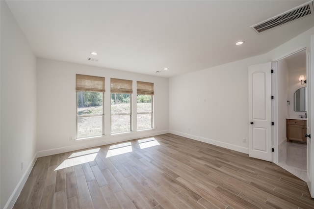 unfurnished room featuring light wood-type flooring