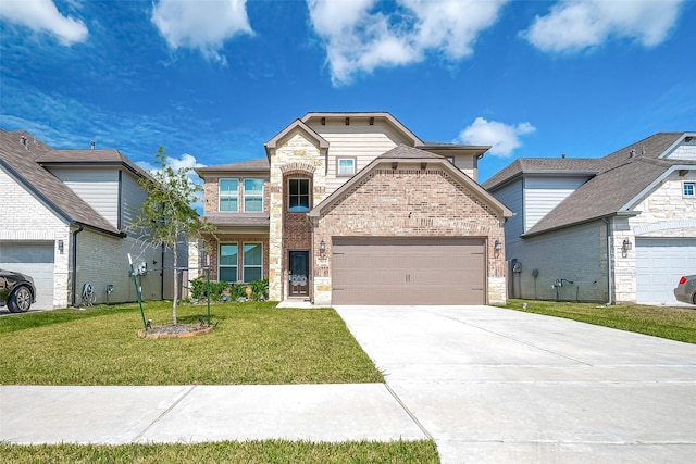 3423 Hackberry Tree Ln, Katy, TX 77449 - french country inspired facade featuring an attached garage, brick siding, concrete driveway, a front yard, and stone siding
