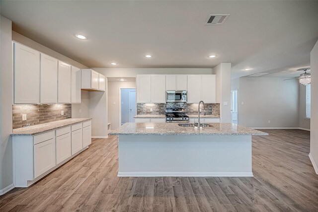 3423 Hackberry Tree Ln, Katy, TX 77449 - kitchen with a sink, appliances with stainless steel finishes, baseboards, decorative backsplash, and recessed lighting