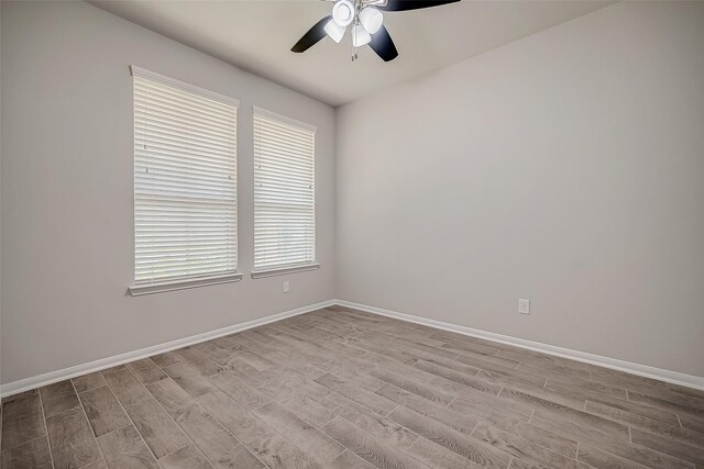 3423 Hackberry Tree Ln, Katy, TX 77449 - spare room featuring wood finished floors, ceiling fan, and baseboards