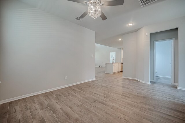 3423 Hackberry Tree Ln, Katy, TX 77449 - unfurnished living room with a ceiling fan, light wood-style floors, a sink, baseboards, and recessed lighting