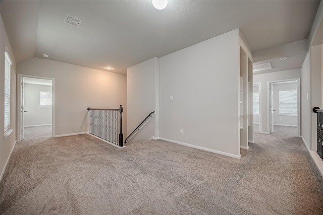 3423 Hackberry Tree Ln, Katy, TX 77449 - carpeted empty room featuring vaulted ceiling and baseboards