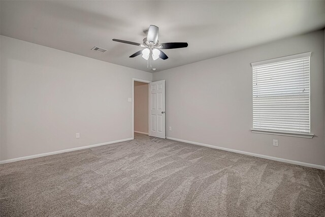 3423 Hackberry Tree Ln, Katy, TX 77449 - empty room featuring a ceiling fan, carpet floors, and baseboards