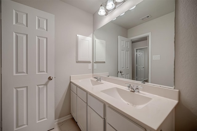 3423 Hackberry Tree Ln, Katy, TX 77449 - bathroom with double vanity, baseboards, and marble look tiles
