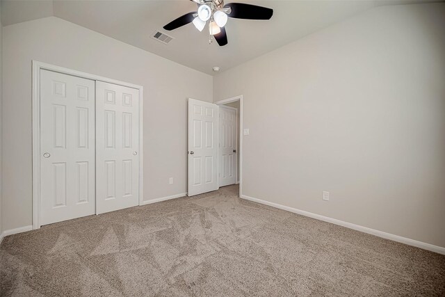 3423 Hackberry Tree Ln, Katy, TX 77449 - unfurnished bedroom featuring carpet, vaulted ceiling, baseboards, a closet, and ceiling fan