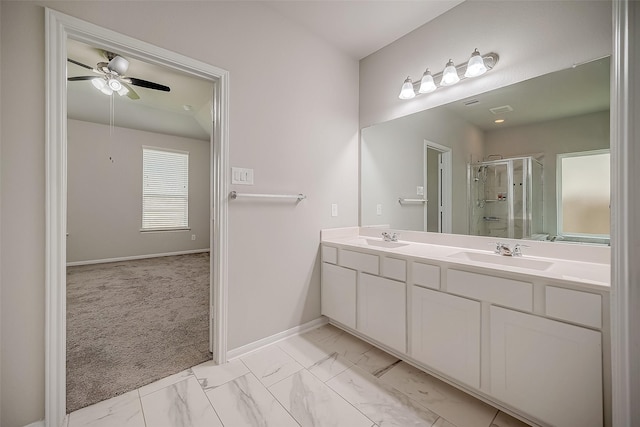 3423 Hackberry Tree Ln, Katy, TX 77449 - bathroom featuring a stall shower, marble finish flooring, baseboards, double vanity, and a ceiling fan