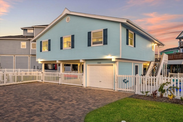 view of front of property with a garage