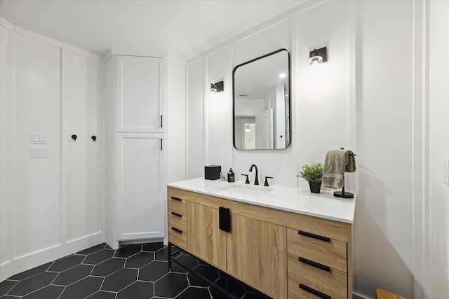 bathroom featuring tile patterned flooring and vanity