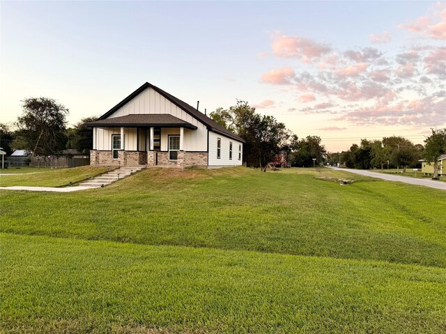 view of front of property with a yard