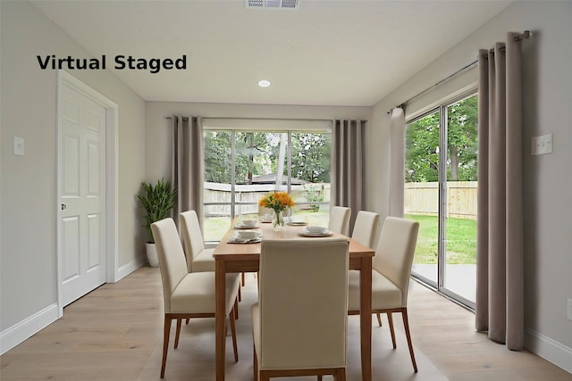 dining room with light hardwood / wood-style floors