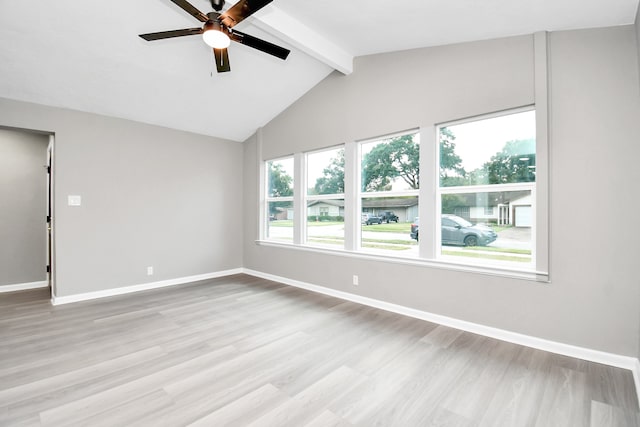 empty room featuring light hardwood / wood-style flooring, vaulted ceiling with beams, and ceiling fan