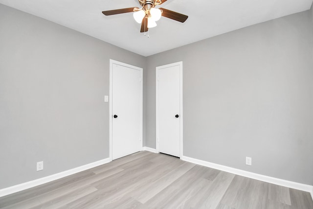 unfurnished room featuring ceiling fan and light hardwood / wood-style flooring