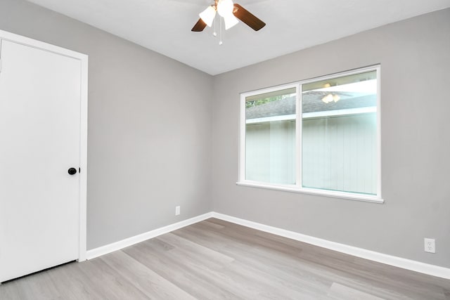 spare room with ceiling fan and light hardwood / wood-style flooring