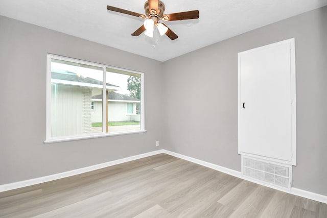 unfurnished room with ceiling fan and light hardwood / wood-style floors