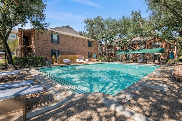 view of swimming pool featuring a patio area