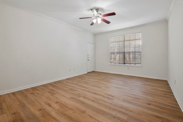 spare room with ceiling fan, light wood-type flooring, and ornamental molding