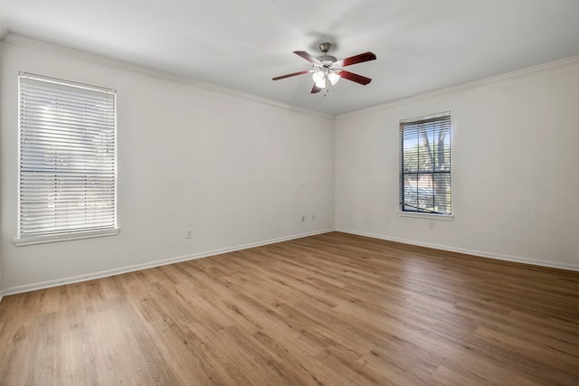 empty room with light hardwood / wood-style floors, ceiling fan, and crown molding