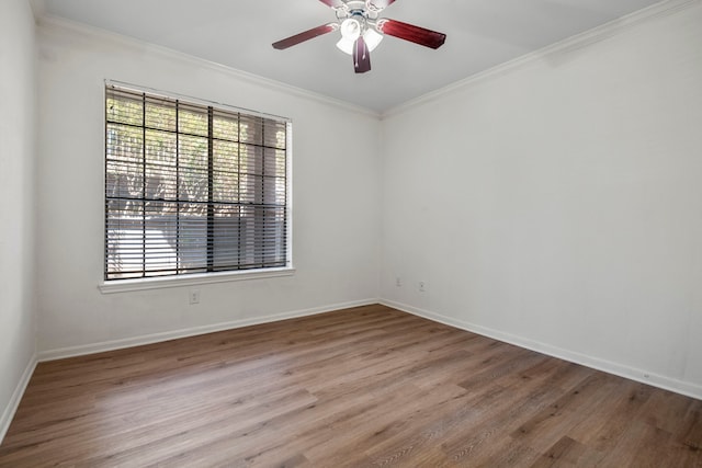 empty room with ceiling fan, crown molding, light hardwood / wood-style floors, and a healthy amount of sunlight