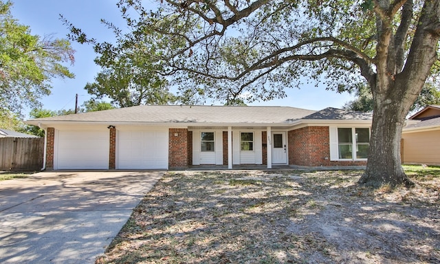 ranch-style home with a garage and a porch